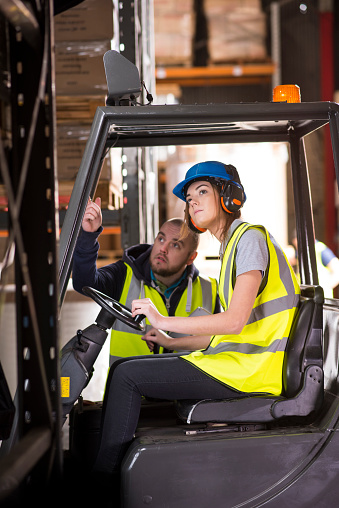 Woman training on forklift