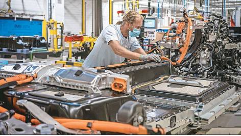 A Volvo employee works in the automaker’s battery assembly plant in Belgium.
