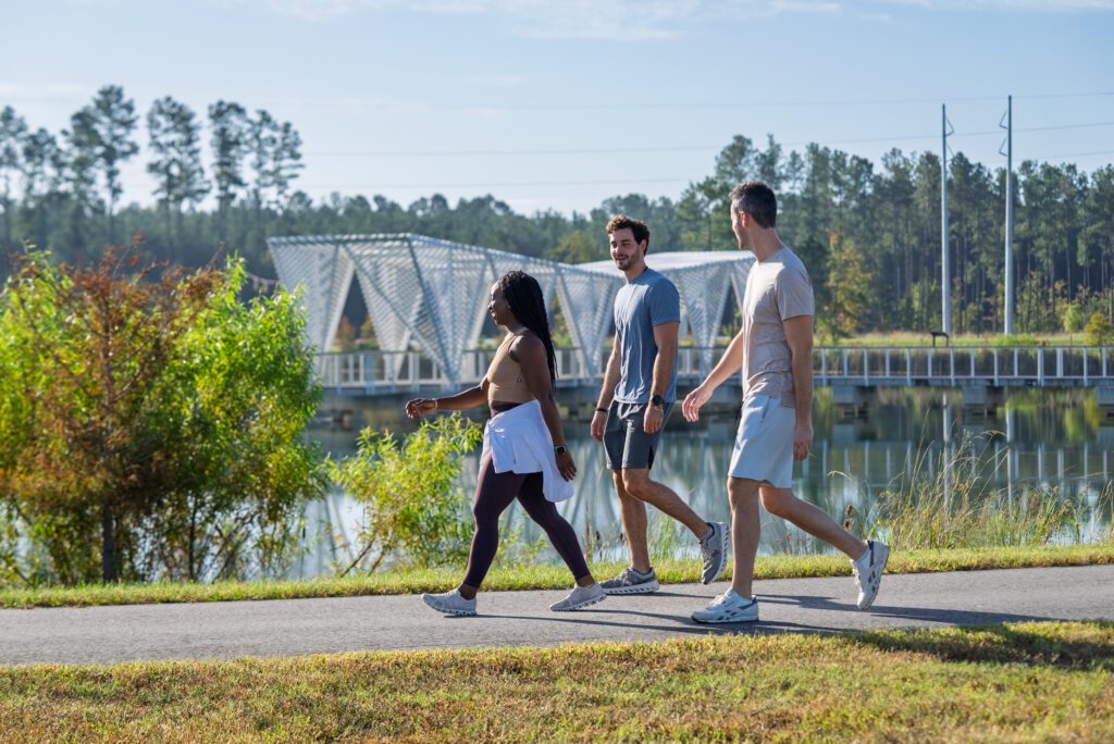 People enjoying a walking path at Camp Hall