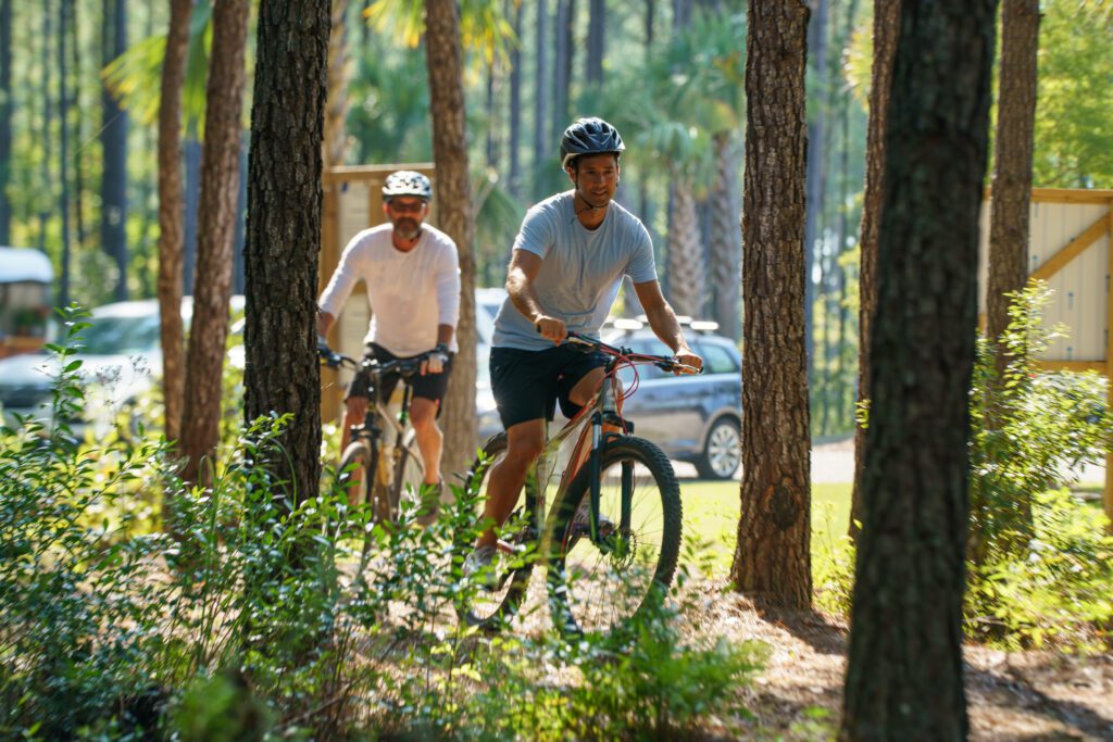 People riding bikes on Camp Hall trail system
